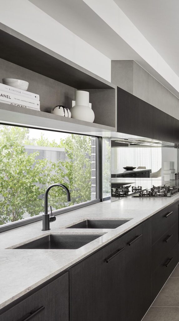 Modern open-concept kitchen renovation completed by professional remodeling contractors service areas