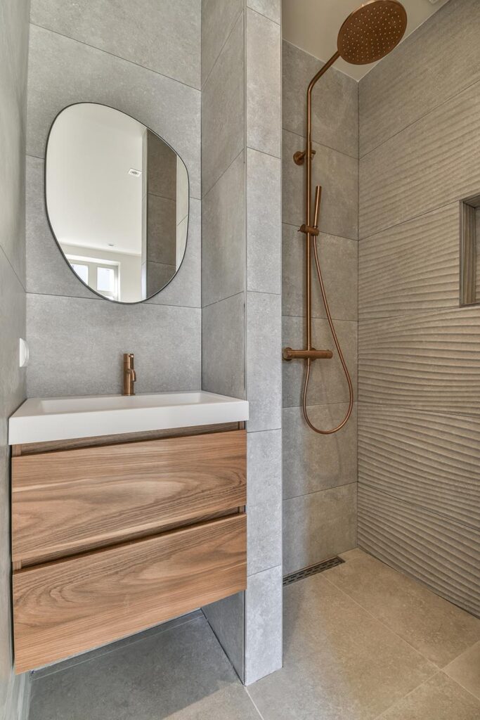 Modern residential bathroom transformation featuring high-quality refinishing services in Southfield, MI by Backwoods Refinishing.